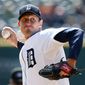 Detroit Tigers pitcher Max Scherzer throws against the Kansas City Royals in the first inning of a baseball game in Detroit Wednesday, April 2, 2014. (AP Photo/Paul Sancya)
