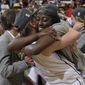 Stanford forward Chiney Ogwumike, front right, hugs forward Mikaela Ruef after Stanford defeated North Carolina 74-65 in a regional final of the NCAA women&#39;s college basketball tournament in Stanford, Calif., Tuesday, April 1, 2014. (AP Photo/Marcio Jose Sanchez)