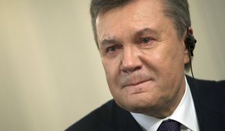 Ousted Ukrainian President Viktor Yanukovych reacts during an interview with The Associated Press, in Rostov-on-Don, Russia, on Wednesday, April 2, 2014. Yanukovych says the annexation of Crimea was a tragedy and he would have done everything possible to prevent it, had he remained in power. (AP Photo/Ivan Sekretarev)