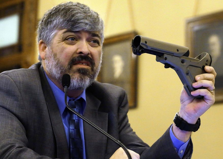 FILE - In this Feb. 28, 2013 file photo, Todd Vandermyde, the powerful Illinois lobbyist for the National Rifle Association, speaks at a House committee meeting on assault weapons in Springfield, Ill. Vandermyde is helping to rewrite a state law that he broke. In an article published Wednesday, April 2, 2014, Vandermyde said he was only exercising his rights as a citizen when he intervened to push legislation to loosen restrictions on transporting crossbows and enlisted the House Republican leader to tighten authority for police to enter private land. Vandermyde was ticketed by state conservation police officers and fined $120 for carrying an uncased, loaded crossbow on an ATV in December during a hunting trip. (AP Photo/Seth Perlman, File)