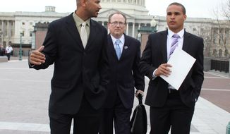 Former Northwestern University football quarterback Kain Colter, right, Ramogi Huma, founder and President of the National College Players Association left, and Tim Waters, Political Director of the United Steel Workers, arrive on Capitol Hill in Washington, Wednesday, April, 2, 2014. Members of a group seeking to unionize college athletes are looking for allies on Capitol Hill as they brace for an appeal of a ruling that said full scholarship athletes at Northwestern University are employees who have the right to form a union. Colter _ the face of a movement to give college athletes the right to unionize _ and Ramogi Huma, the founder and president of the National College Players Association, scheduled meetings Wednesday with lawmakers. (AP Photo/Lauren Victoria Burke)