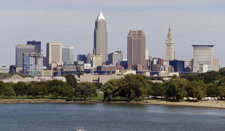 FILE -This Tuesday, Sept. 11, 2012 file photo shows the Cleveland skyline taken from Edgewater Park in Cleveland. (AP Photo/Mark Duncan, File)