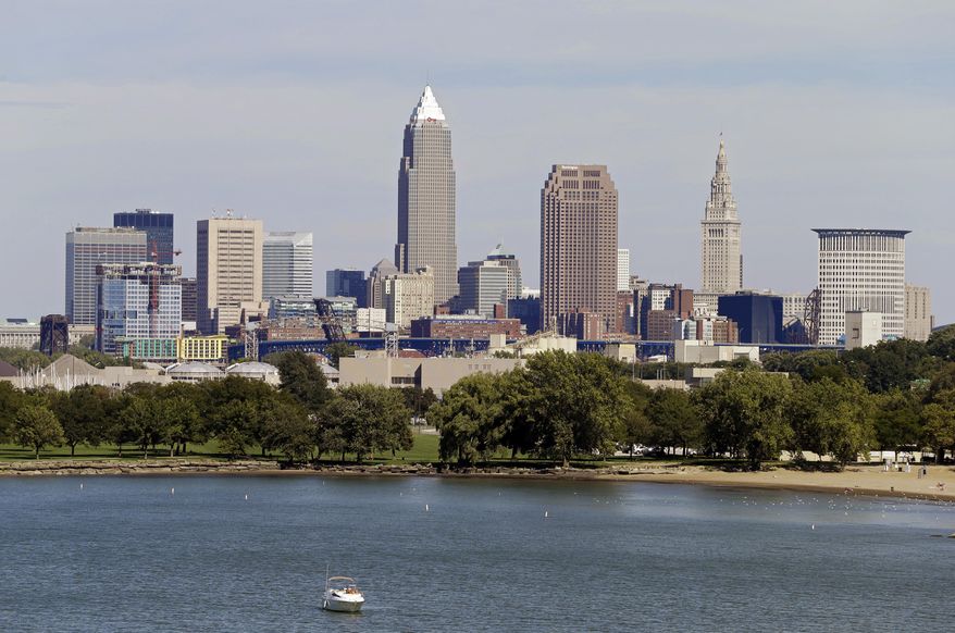 FILE -This Tuesday, Sept. 11, 2012 file photo shows the Cleveland skyline taken from Edgewater Park in Cleveland. (AP Photo/Mark Duncan, File)