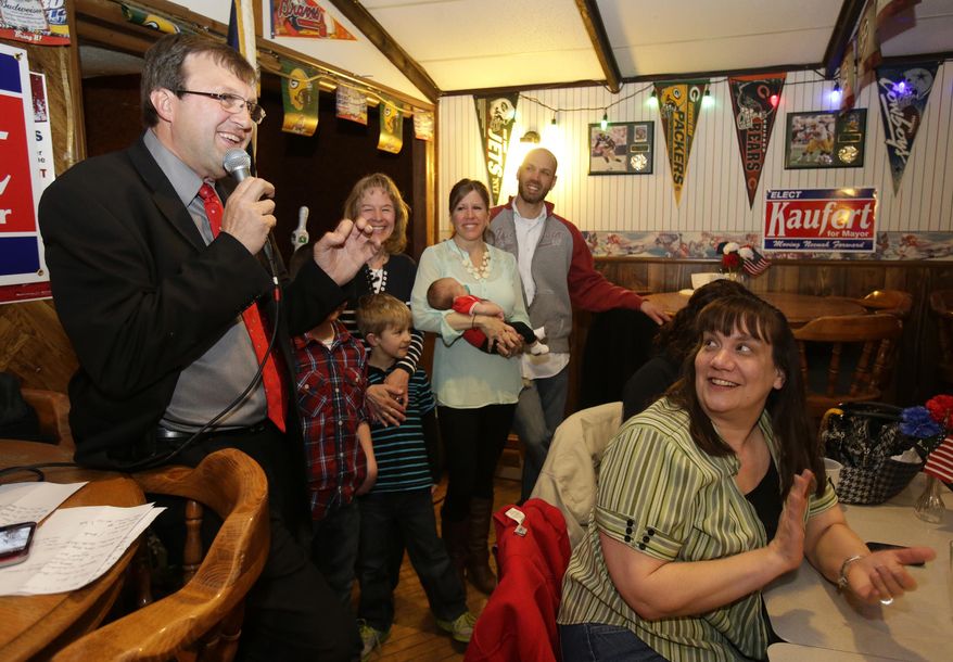 In this photo taken on Tuesday, April 1, 2014, Dean Kaufert gives his victory speech after being elected mayor Tuesday, April, 1, 2014, at Under the Dome in Neenah, Wis. Kaufert defeated three-term incumbent George Scherck in unofficial returns from Tuesday's election. (AP Photo/The Post-Crescent, Dan Powers) NO SALES