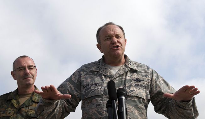 ***FILE** U.S. European Commander and Supreme Allied Commander – Europe (SACEUR) Air Force Gen. Philip Breedlove (front), joined by KFOR Commander Maj. Gen. Volker Halbauer, speaks during a joint press conference in Kosovo capital Pristina military airport in Slatina on June 7, 2013. (Associated Press)
