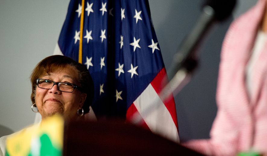 Council Member Anita Bonds (D-At Large) listens as Muriel Bowser speaks at a press conference at the National Press Club after winning the Washington, D.C. mayoral democratic primary, Washington, D.C., Wednesday, April 2, 2014. (Andrew Harnik/The Washington Times)