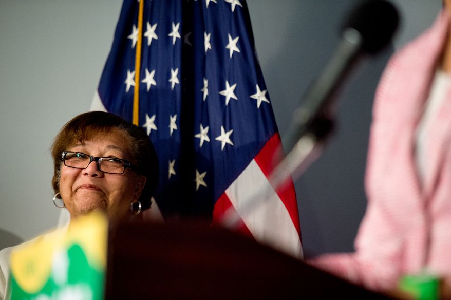 Council Member Anita Bonds (D-At Large) listens as Muriel Bowser speaks at a press conference at the National Press Club after winning the Washington, D.C. mayoral democratic primary, Washington, D.C., Wednesday, April 2, 2014. (Andrew Harnik/The Washington Times)