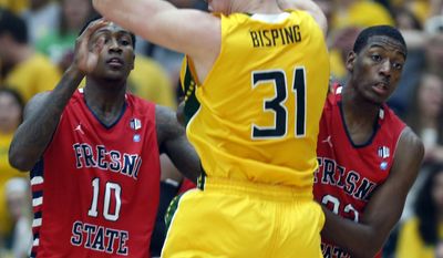 Fresno State defenders Alex Davis (10) and Paul Watson (22) guard Siena&#39;s Brett Bisping (31) during the first half of a College Basketball Invitational championship series game Wednesday, April 2, 2014, in Loudonville, N.Y. (AP Photo/Mike Groll)