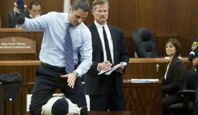 Prosecutor John Jordan does a crime scene demonstration, using a dummy, during the trial against Ana Trujillo  Tuesday, April 1, 2014, in Houston. Trujillo, 45, is charged with murder, accused of killing her 59-year-old boyfriend, Alf Stefan Andersson with the heel of a stiletto shoe, at his condominium in June 2013. Defense attorney Jack Carroll, center, and crime scene investigator Christopher Duncan are shown in the background. (AP Photo/Houston Chronicle, Brett Coomer ) MANDATORY CREDIT.