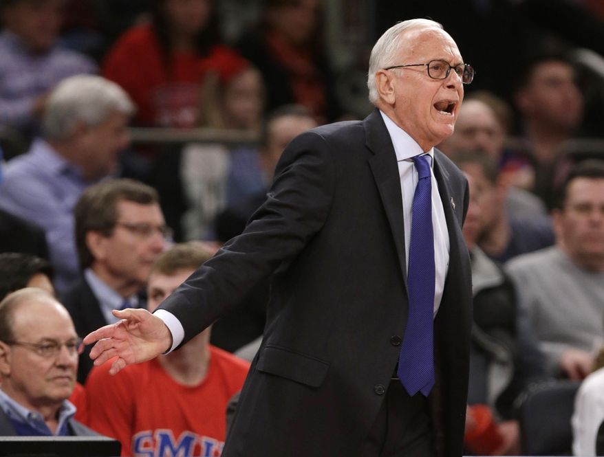 SMU coach Larry Brown calls out to his team during the first half of an NCAA college basketball game against Minnesota in the final of the NIT on Thursday, April 3, 2014, in New York. (AP Photo/Frank Franklin II)