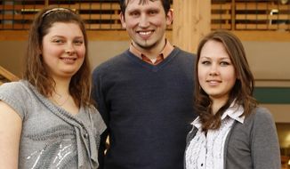 From left, Northwest College students from Ukraine, Inna Kucherenko, Iurii Kyrychenko and Yarsolava Krypak pose for a photo at Northwest College in Powell, Wyo., on March 27, 2014.  Events at home occupy the thoughts of three Northwest College students more than usual these days. For them, home is Ukraine, a place that, due to Russia&#39;s annexation of Crimea, has dominated world news in recent weeks.  (AP Photo/The Powell Tribune, Ilene Olson)
