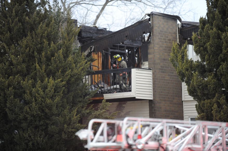 Firefighters respond to the scene of fire at the Dartmouth Square Apartments in Inkster, Mich., on Thursday, April 3, 2014. Authorities say no one was injured following an apartment building fire in suburban Detroit that displaced dozens of residents and gutted the building. The fire was reported about 1:45 a.m. Thursday in Inkster, forcing residents to evacuate the complex. (AP Photo/Detroit News, David Coates) DETROIT FREE PRESS OUT; HUFFINGTON POST OUT