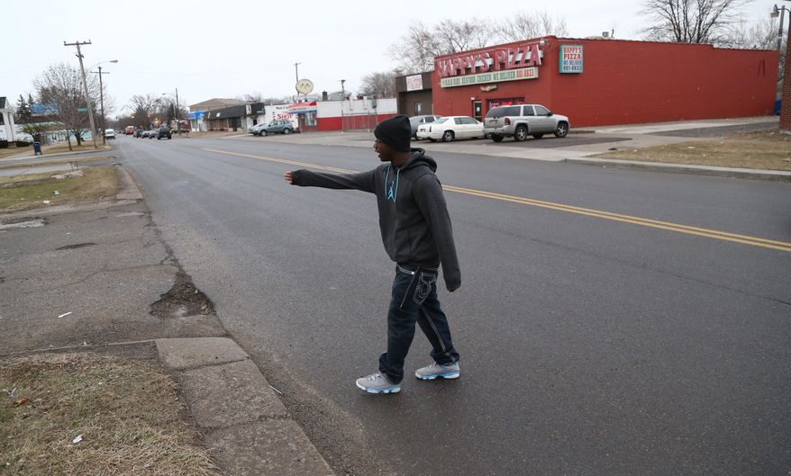 Desmond Key talks about the auto accident that involved 10 year-old David Harris Thursday, April 3, 2014. Harris was hit by a car crossing Morang street on Detroit's east side, Wednesday, April 2,2 014. The driver stopped and was attacked by onlookers. (AP Photo/Detroit Free Press, Kirthmon F.Dozier)