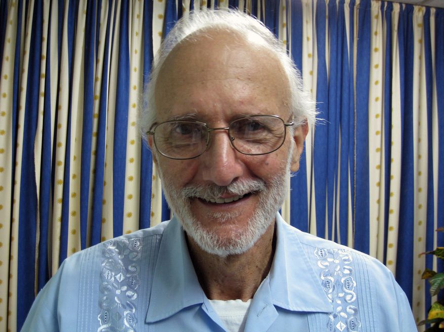 FILE - In this Nov. 27, 2012 file photo provided by James L. Berenthal, jailed American Alan Gross poses for a photo during a visit by Rabbi Elie Abadie and U.S. lawyer James L. Berenthal at Finlay military hospital as he serves a prison sentence in Havana, Cuba. The U.S. government masterminded the creation of a "Cuban Twitter" a communications network designed to undermine the communist government in Cuba, built with secret shell companies and financed through foreign banks, The Associated Press has learned. The project, dubbed "ZunZuneo," slang for a Cuban hummingbird’s tweet, was publicly launched shortly after the 2009 arrest of Gross. He was imprisoned after traveling repeatedly to the country on a separate, clandestine USAID mission to expand Internet access using sensitive technology that only governments use. (AP Photo/James L. Berenthal, File)