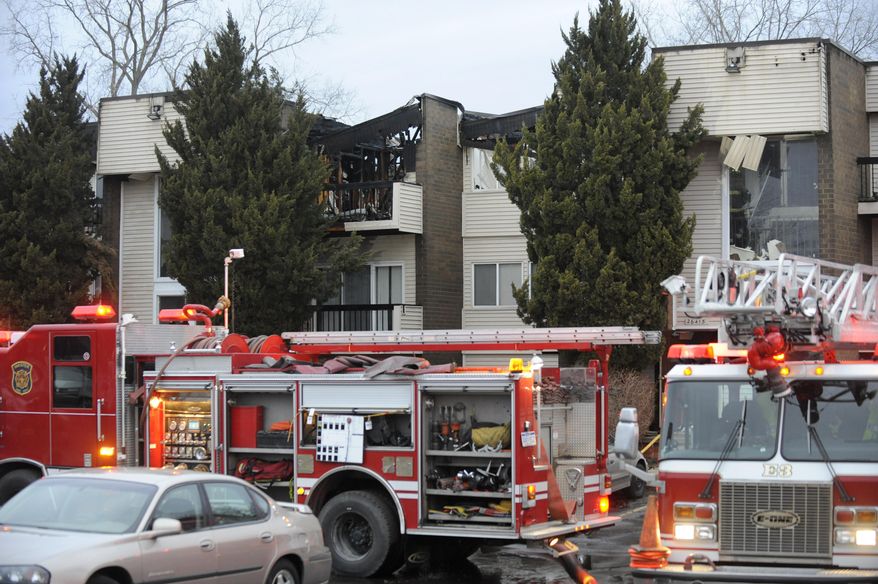Firefighters respond to the scene of fire at the Dartmouth Square Apartments in Inkster, Mich., on Thursday, April 3, 2014. Authorities say no one was injured following an apartment building fire in suburban Detroit that displaced dozens of residents and gutted the building. The fire was reported about 1:45 a.m. Thursday in Inkster, forcing residents to evacuate the complex. (AP Photo/Detroit News, David Coates) DETROIT FREE PRESS OUT; HUFFINGTON POST OUT