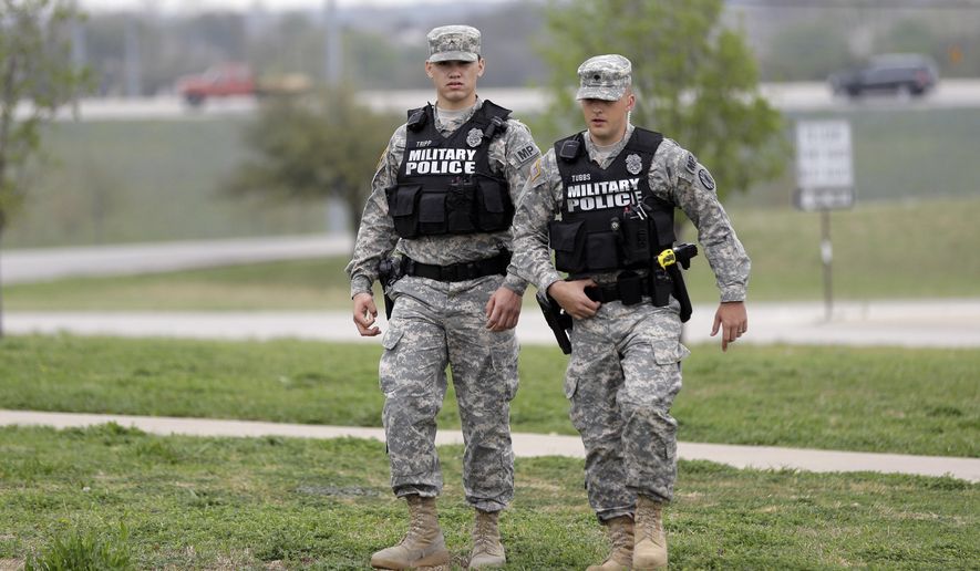 Military police patrol near Fort Hood&#39;s main gate, Thursday, April 3, 2014, in Fort Hood, Texas. A soldier, Spc. Ivan Lopez, opened fire Wednesday on fellow service members at the Fort Hood military base, killing three people and wounding 16 before committing suicide. (Associated Press) **FILE**