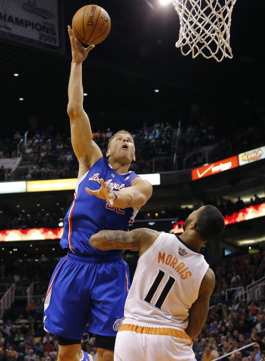 Los Angeles Clippers forward Blake Griffin (32) shoots over Phoenix Suns forward Markieff Morris (11) during the first half of an NBA basketball game, Wednesday, April 2, 2014, in Phoenix. (AP Photo/Matt York)