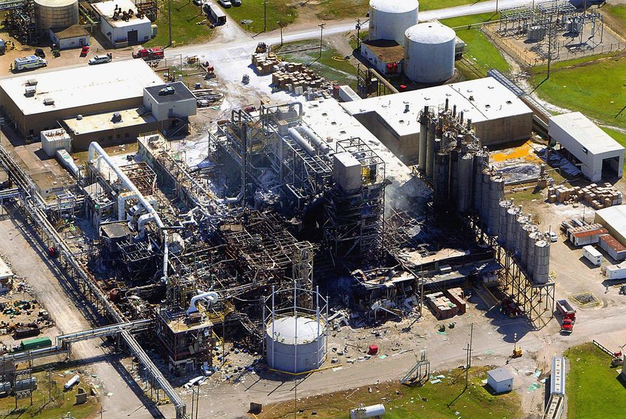 FILE - In this April 26, 2004 aerial file photo, shows the smoldering remains from an explosion April 23 at the Formosa Chemical Plant in Illiopolis, Ill., that killed five people. The former plastics plant in central Illinois is now all but demolished and cleaned up according to Illinois state environmental regulators. (AP Photo/State Journal Register, T.J. Salsman, File)