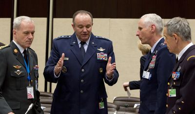 U.S. Air Force Gen. Philip Breedlove, the Supreme Allied Commander in Europe, second left, speaks to colleagues during a meeting of the North Atlantic Council with Non-NATO ISAF Contributing Nations at NATO headquarters in Brussels on Wednesday, April 2, 2014. (AP Photo/Virginia Mayo)