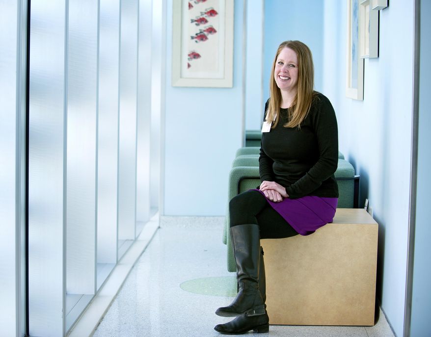 March of Dimes NICU Family Support Specialist Amy Nyberg is photographed on March 18, 2014 in Grand Rapids, Mich. Nyberg has worked with the Michigan Chapter's NICU Family Support Program at Helen DeVos Children's Hospital which has recently won the March of Dimes national award for NICU Family Support Project of the Year. (AP Photo/The Grand Rapids Press, Emily Rose Bennett) ALL LOCAL TV OUT; LOCAL TV INTERNET OUT