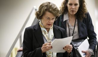 Senate Intelligence Committee Chair Sen. Dianne Feinstein, D-Calif., heads to closed-door meeting on Capitol Hill in Washington, Thursday, April 3, 2014, as the panel votes to approve declassifying part of a secret report on Bush-era interrogations of terrorism suspects puts the onus on the CIA and a reluctant White House to speed the release of one of the most definitive accounts about the government&#39;s actions after the 9/11 attacks. Members of the intelligence community raised concerns that the committee failed to interview top spy agency officials who had authorized or supervised the brutal interrogations. (AP Photo/J. Scott Applewhite)