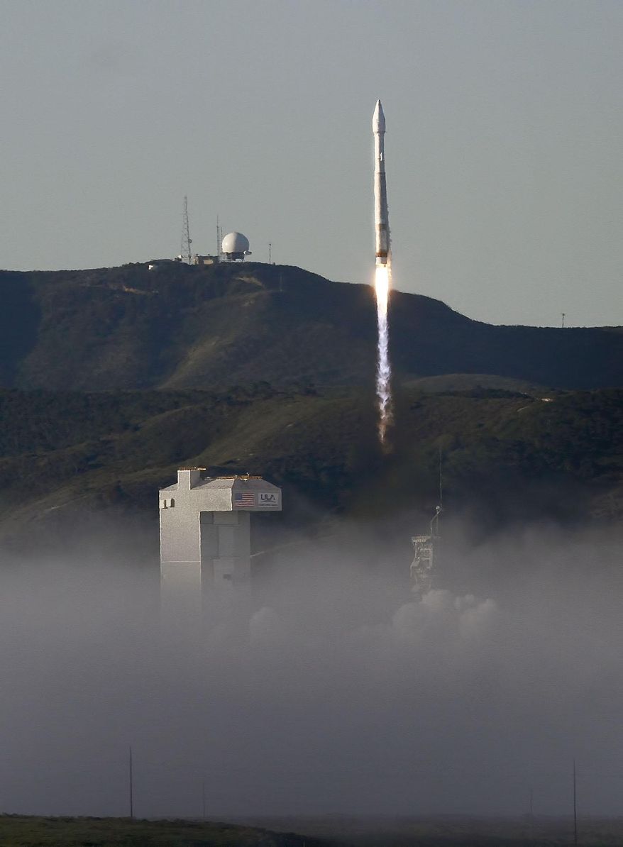 An Atlas 5 rocket is launched at Vandenberg Air Force Base from Space Launch Complex-3 on Thursday, April 3, 2014. A United Launch Alliance Atlas V rocket carrying the 19th Defense Meteorological Satellite Program spacecraft blasted off at 7:46 a.m. PDT and quickly rose into the cold, clear sky above the launch site on the Pacific coast about 130 miles northwest of Los Angeles. The satellite will circle the Earth in a polar orbit at an altitude of about 525 miles (847 kilometers). (AP Photo/The Santa Maria Times, Daniel Dreifuss)