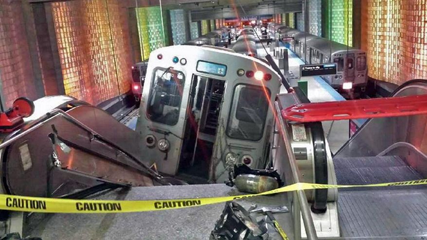 FILE - In this March 24, 2014 file photo a Chicago public-transit train rests on an escalator after it jumped the tracks at Chicago's O'Hare International Airport station. Chicago transit officials say the train operator who acknowledged dozing off before the crash was fired Friday, April 4, 2014. 30 passengers were injured in the crash. (AP Photo/NBC Chicago, Kenneth Webster) MANDATORY CREDIT