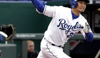 Kansas City Royals&#x27; Norichika Aoki watches his double during the fourth inning of a baseball game against the Chicago White Sox on Friday, April 4, 2014, in Kansas City, Mo. (AP Photo/Charlie Riedel)