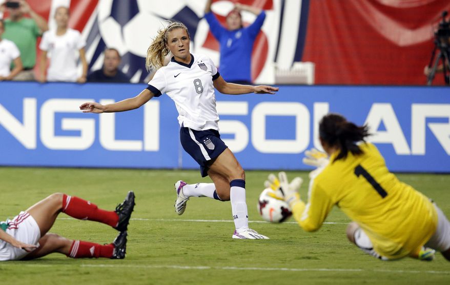 FILE - In this Sept. 3, 2013, file photo, United States defender Kristie Mewis (8) watches as her shot is blocked by Mexico's goalkeeper Cecilia Santiago (1) during the first half of an international friendly soccer match at RFK Stadium in Washington. Mewis' newest road roommate is someone she's quite familiar with, her younger sister. Samantha Mewis was called up for two international friendly soccer games against China PR, beginning Sunday, April, 6, 2014, in the Mile High City. (AP Photo/Alex Brandon, File)