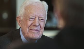FILE - This March 24, 2014 file photo shows former President Jimmy Carter during an interview in New York. Thirty-six years after President Jimmy Carter made peace between Egypt and Israel, “Camp David” is now both history and theater. Carter and his wife Rosalynn returned to Washington on Thursday night to open a new play commissioned by Arena Stage. It retraces the 13 days of tense negotiations in 1978. By the time the lights came up, the former president had tears in his eyes and was soon hugging actor Richard Thomas who played him on stage. (AP Photo/Charles Dharapak) .  (AP Photo/Bebeto Matthews, File)