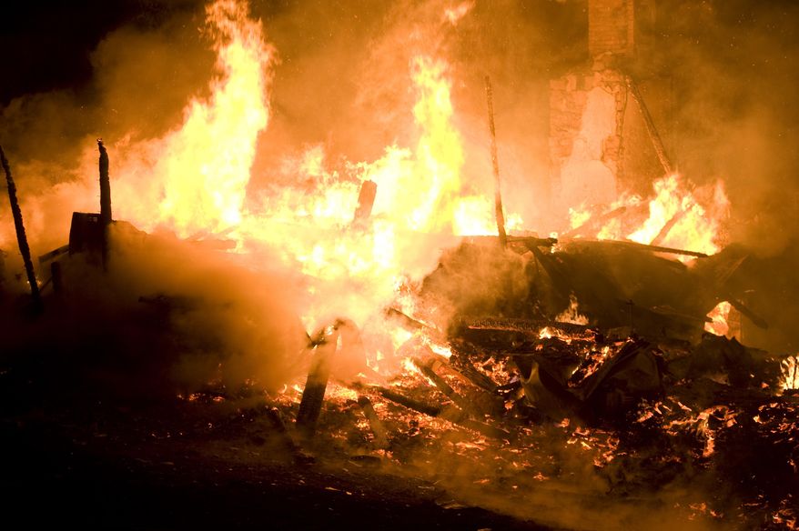 Fire destroys a house on Friday, April 4, 2014 outside Danville, Pa. The early morning farmhouse fire in north-central Pennsylvania killed three children, ages 2 to 13, authorities said. The Northumberland County coroner identified the victims as 13-year old Daniel Dissinger, 7-year old Gavin Dissinger and 2-year old Arthur Dissinger. The deaths were ruled accidental. The children's mother was at work at the time of the fire, Kriner said. He said a 13-year-old boy and 14-year-old girl managed to escape from the home and were treated for injuries that weren't life-threatening. Another child was staying at a friend's house overnight, he said. The home had almost completely collapsed by the time the first crews arrived, officials said. (AP Photo/The News-Item, Larry Deklinski)