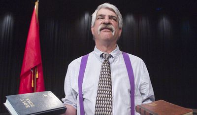 This photo taken March 25, 2014, shows attorney Jim Buttrey portraying attorney Henry Drummond in the Community Theatre of Howell's production of "Inherit the Wind,"  at Howell High School Freshman Campus theater. (AP Photo / Livingston County Daily Press & Argus, Gillis Benedict)