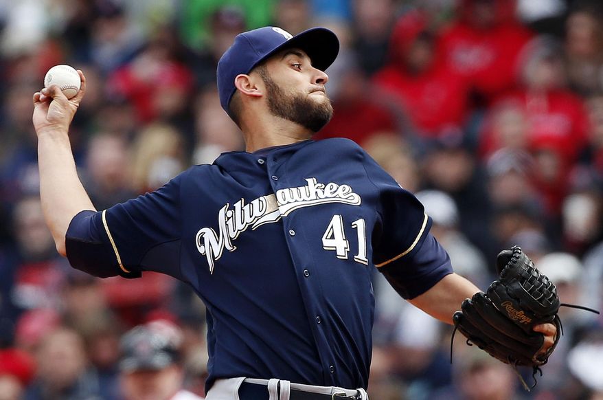 Milwaukee Brewers starting pitcher Marco Estrada delivers to the Boston Red Sox in the second inning at Fenway Park in Boston, Friday, April 4, 2014. (AP Photo/Elise Amendola)