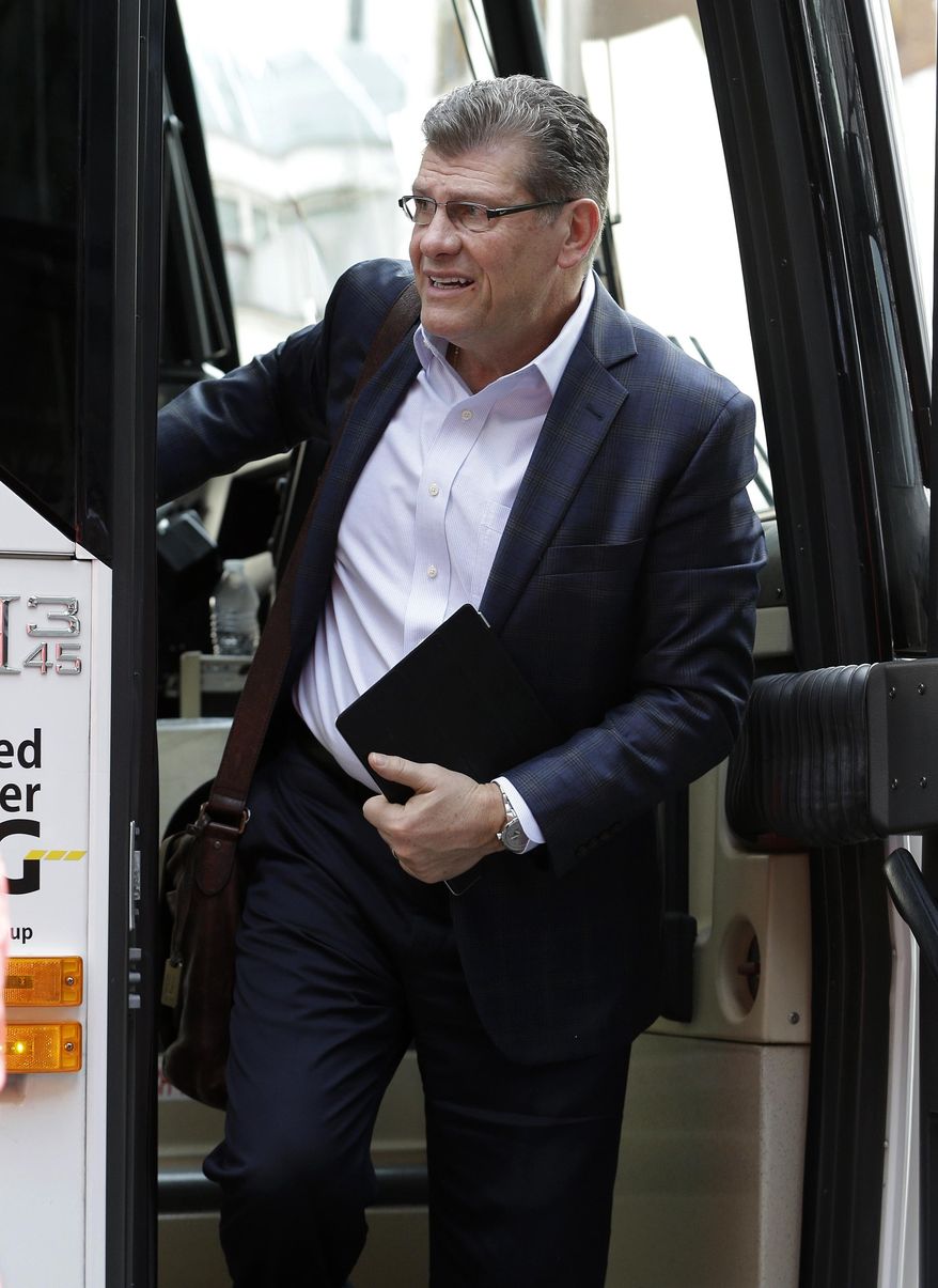 Connecticut coach Geno Auriemma gets off the team bus as he arrives at a hotel Thursday, April 3, 2014, in Nashville, Tenn. Connecticut is scheduled to play Stanford in the semifinals of the NCAA women's college basketball tournament Sunday. (AP Photo/Mark Humphrey)