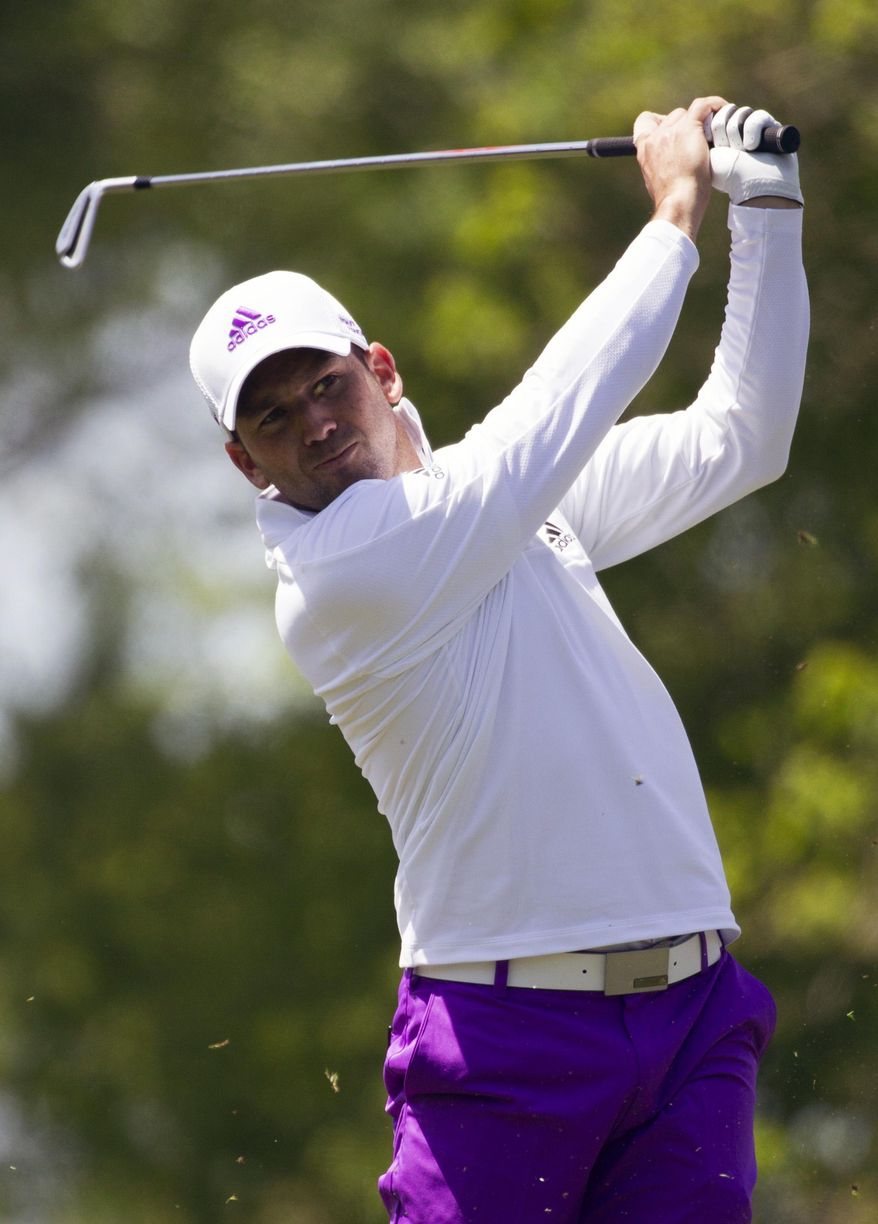 Sergio Garcia tees off on the ninth hole during the second round of the Houston Open golf tournament, Friday, April 4, 2014, in Humble, Texas. Garcia has surged to the top of the leaderboard after shooting a 7-under 65 in the second round. (AP Photo/Patric Schneider)