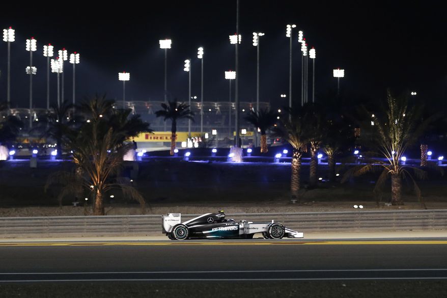 Mercedes driver Nico Rosberg of Germany steers his car during the second free practice ahead of the Bahrain Formula One Grand Prix at the Formula One Bahrain International Circuit in Sakhir, Bahrain, Friday, April 4, 2014. (AP Photo/Hassan Ammar)