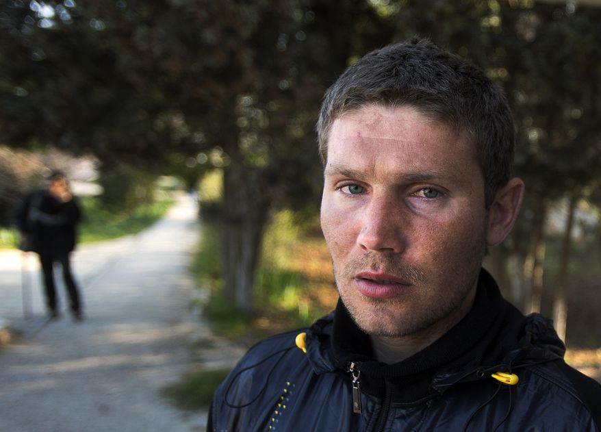 In this photo taken Tuesday, April 1, 2014, Alexander Pevzenko, 30, a patient of treatment for drug addiction, poses in Sevastopol, Crimea. Across the Black Sea peninsula, some 800 heroin addicts and other needle-drug users take part in methadone programs, seen as an important part of efforts to curb HIV infections by taking the patients away from hypodermic needles that can spread the AIDS-causing virus. After Russia's annexation of Crimea methadone was banned. The ban could undermine years of efforts to reduce the spread of AIDS in Crimea. (AP Photo/Pavel Golovkin)