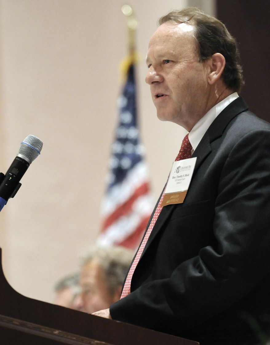 FILE - In this April 2009 file photo photo provided by the Cincinnati Bar Association, federal Judge Timothy Black accepts an award from the bar for his involvement in the community. Black on Friday, April 4, 2014 said he will strike down Ohio's voter-approved ban on gay marriage, meaning the state must recognize marriages of gay couples who legally wed elsewhere. Black made the statement following final arguments in a lawsuit that challenged the constitutionality of the marriage ban. (AP Photo/Cincinnati Bar Association, File)