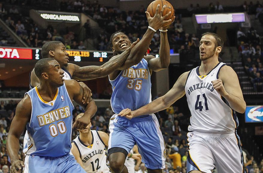Denver Nuggets forward Kenneth Faried (35) with teammate Darrell Arthur (00) gets fouled on the way to the basket by Memphis Grizzlies forward Ed Davis, left, with help by Kosta Koufos (41) in the first half of an NBA basketball game Friday, April 4, 2014, in Memphis, Tenn. (AP Photo/Lance Murphey)