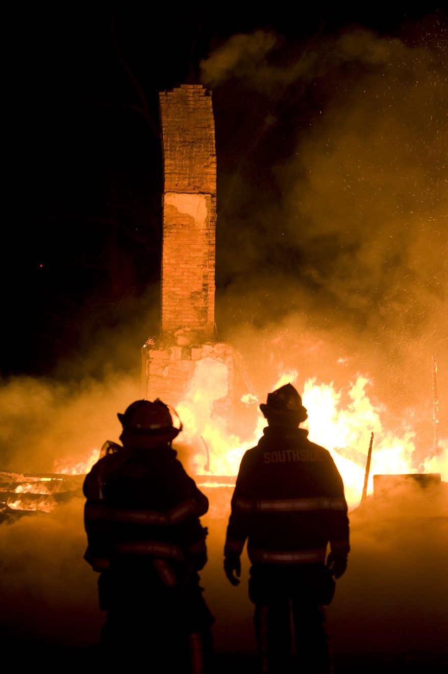 Firefighters try to put out a early morning fire on Friday, April 4, 2014 outside Danville, Pa. The early morning farmhouse fire in north-central Pennsylvania killed three children, ages 2 to 13, authorities said. The Northumberland County coroner identified the victims as 13-year old Daniel Dissinger, 7-year old Gavin Dissinger and 2-year old Arthur Dissinger. The deaths were ruled accidental. The children's mother was at work at the time of the fire, Kriner said. He said a 13-year-old boy and 14-year-old girl managed to escape from the home and were treated for injuries that weren't life-threatening. Another child was staying at a friend's house overnight, he said. The home had almost completely collapsed by the time the first crews arrived, officials said. (AP Photo/The News-Item, Larry Deklinski)