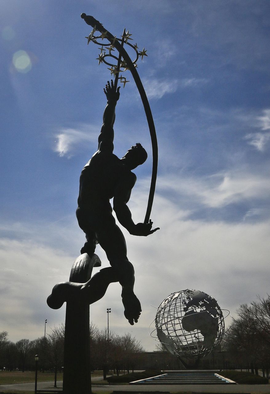 A restored statue and a giant metal globe called the Unisphere, are remaining symbols from the 1964 World's Fair, Tuesday April 1, 2014 in the Queens borough of New York. As this month’s 50th anniversary of the 1964 New York World’s Fair approaches, a group of preservationists is fighting to other structures some see as annoying eyesores that should be torn down. (AP Photo/Bebeto Matthews)