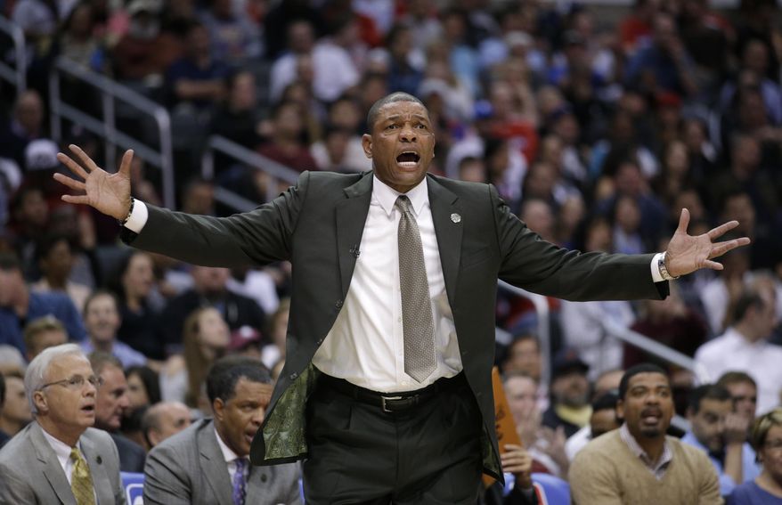 Los Angeles Clippers head coach Doc Rivers reacts to a play during the first half of an NBA basketball game against the Dallas Mavericks on Thursday, April 3, 2014, in Los Angeles. (AP Photo/Jae C. Hong)