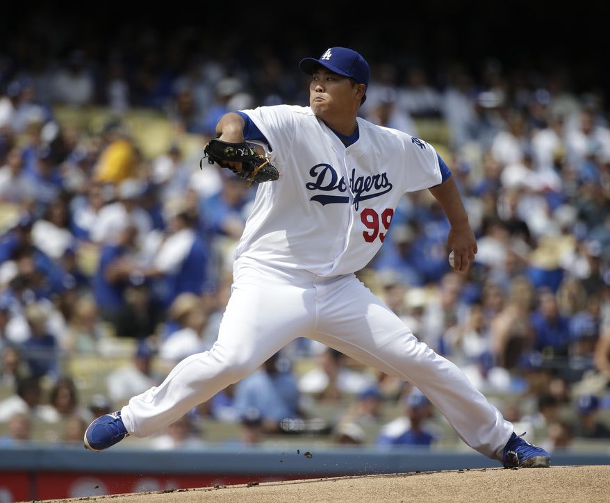 Los Angeles Dodgers starting pitcher Hyun-jin Ryu, of South Korea, throws against the San Francisco Giants during the first inning of a baseball game on Friday, April 4, 2014, in Los Angeles. (AP Photo/Jae C. Hong)