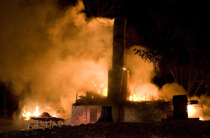 Firefighters try to put out a early morning fire on Friday, April 4, 2014 outside Danville, Pa. The early morning farmhouse fire in north-central Pennsylvania killed three children, ages 2 to 13, authorities said. The Northumberland County coroner identified the victims as 13-year old Daniel Dissinger, 7-year old Gavin Dissinger and 2-year old Arthur Dissinger. The deaths were ruled accidental. The children's mother was at work at the time of the fire, Kriner said. He said a 13-year-old boy and 14-year-old girl managed to escape from the home and were treated for injuries that weren't life-threatening. Another child was staying at a friend's house overnight, he said. The home had almost completely collapsed by the time the first crews arrived, officials said. (AP Photo/The News-Item, Larry Deklinski)