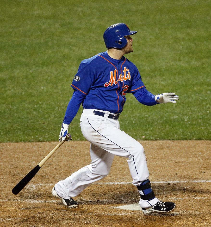 New York Mets' Lucas Duda watches his two-run home run in the fourth inning of a baseball game against the Cincinnati Reds at Citi Field in New York, Friday, April 4, 2014. (AP Photo/Paul J. Bereswill)