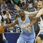 Denver Nuggets guard Ty Lawson (3) tries to get around Memphis Grizzlies guard Nick Calathes in the first half of an NBA basketball game Friday, April 4, 2014, in Memphis, Tenn. (AP Photo/Lance Murphey)