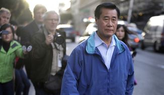 ** FILE ** In this March 26, 2014, file photo, California state Sen. Leland Yee, D-San Francisco, right, leaves the San Francisco Federal Building in San Francisco. (AP Photo/Ben Margot, File)
