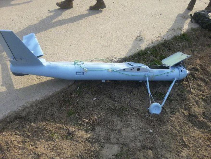 FILE - In this March 31, 2014 file photo released by the South Korea Defense Ministry Wednesday, April 2, 2014, an unmanned drone lies on the ground damaged on Baengnyeong Island, South Korea, near the West Sea border with North Korea when the two Koreas fired hundreds of artillery shells into each other's waters. South Korean experts say two small drones believed to have been flown across the border by the North amid rising military tensions were crude and decidedly low-tech - with cameras available on the Internet for hundreds of dollars - but underscore a potential new threat that must be taken seriously. (AP Photo/South Korea Defense Ministry, File )