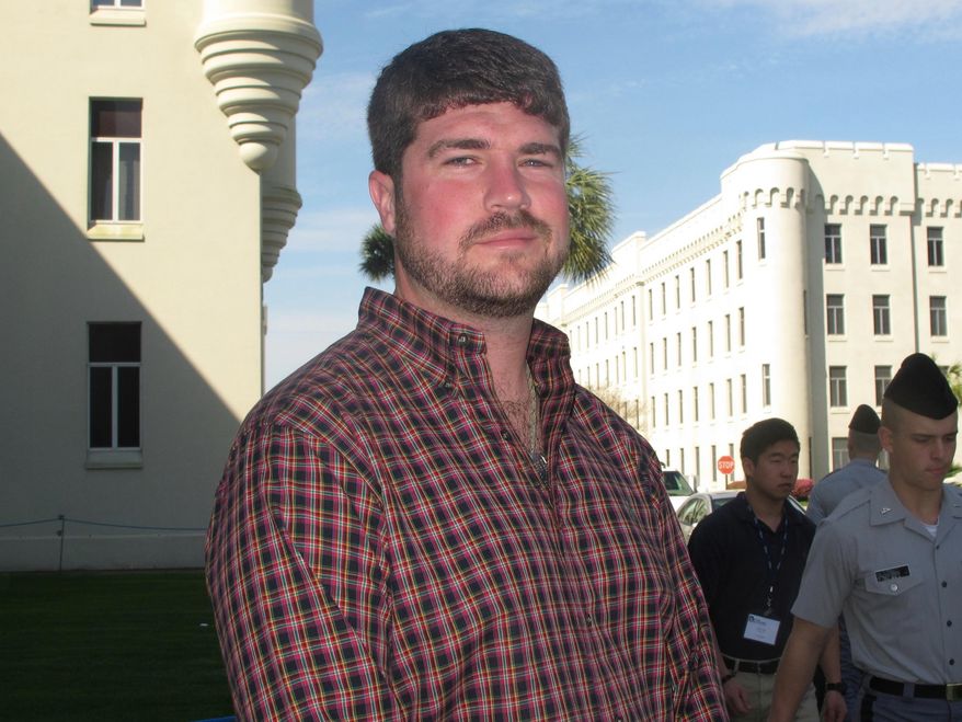 Andrew Kispert, a 27-year-old Marine veteran who is now attending The Citadel, poses on the campus of the military college in Charleston, S.C., on Friday, April 4, 2014. Over the next few years thousands of veterans are expected to attend college as the wars in Iraq and Afghanistan wind down and the military downsizes. (AP Photo/Bruce Smith)