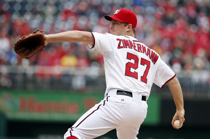 Washington Nationals starting pitcher Jordan Zimmermann throws during the first inning of a baseball home opener against the Atlanta Braves at Nationals Park Friday, April 4, 2014, in Washington. (AP Photo/Alex Brandon)